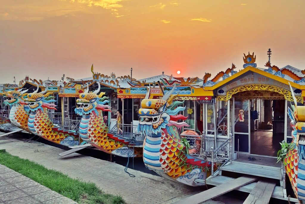 Boat cruising along Perfume River at sunset with scenic views