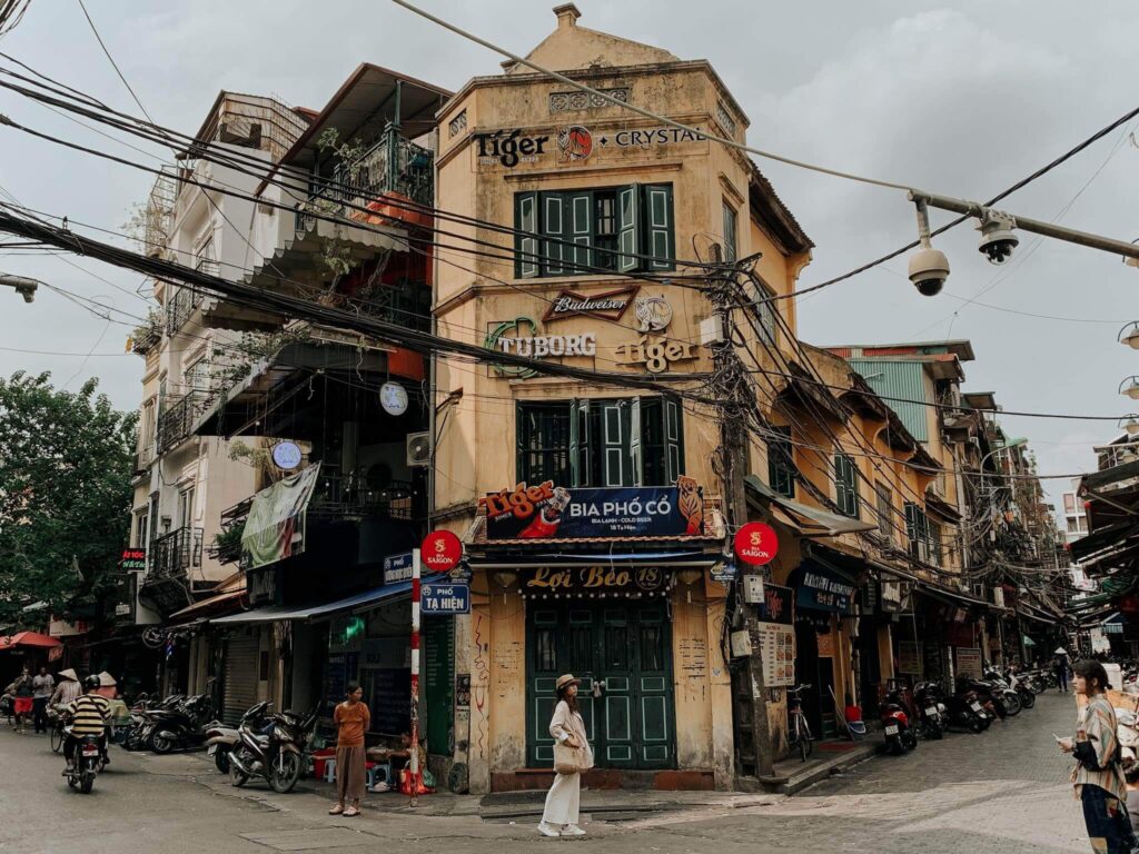 Hanoi Old Quarter streets with local food stalls and busy traffic