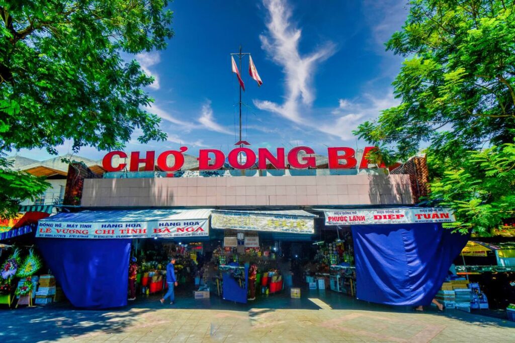 Local market scene with vendors and daily life activities in Hue