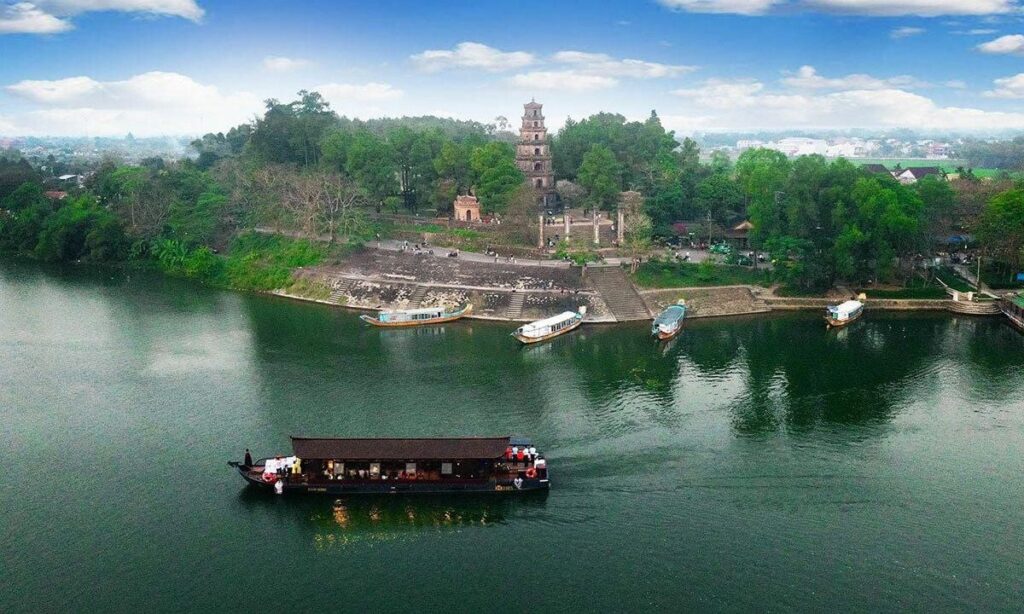 Sunny day in Hue with visitors exploring historical landmarks and gardens